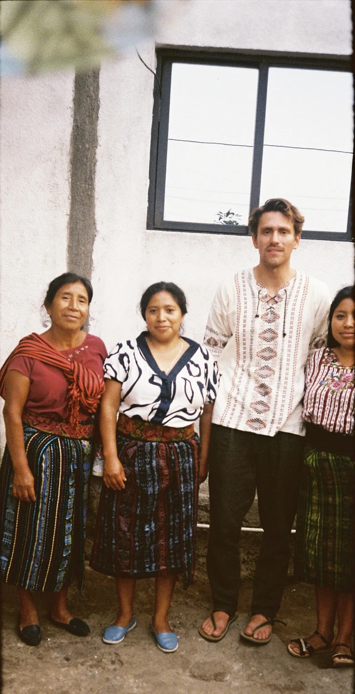 Daniel standing with the Mayan women of San Lucas Tolimán, Guatemala